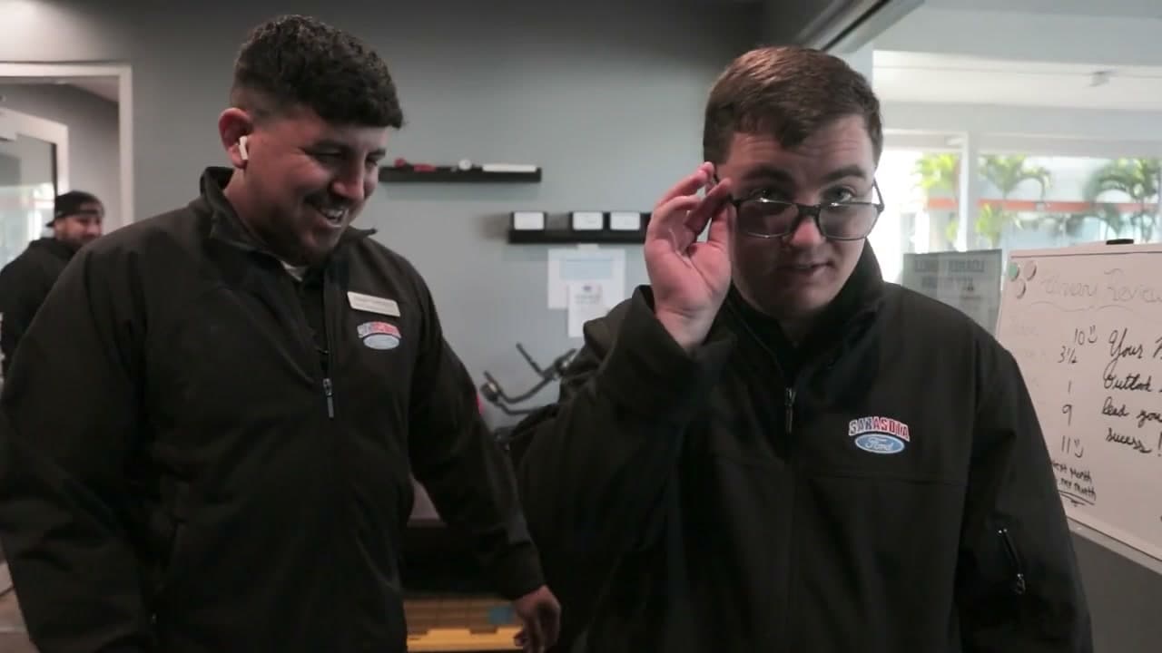 Nick and a colleague sharing a moment at Sarasota Ford